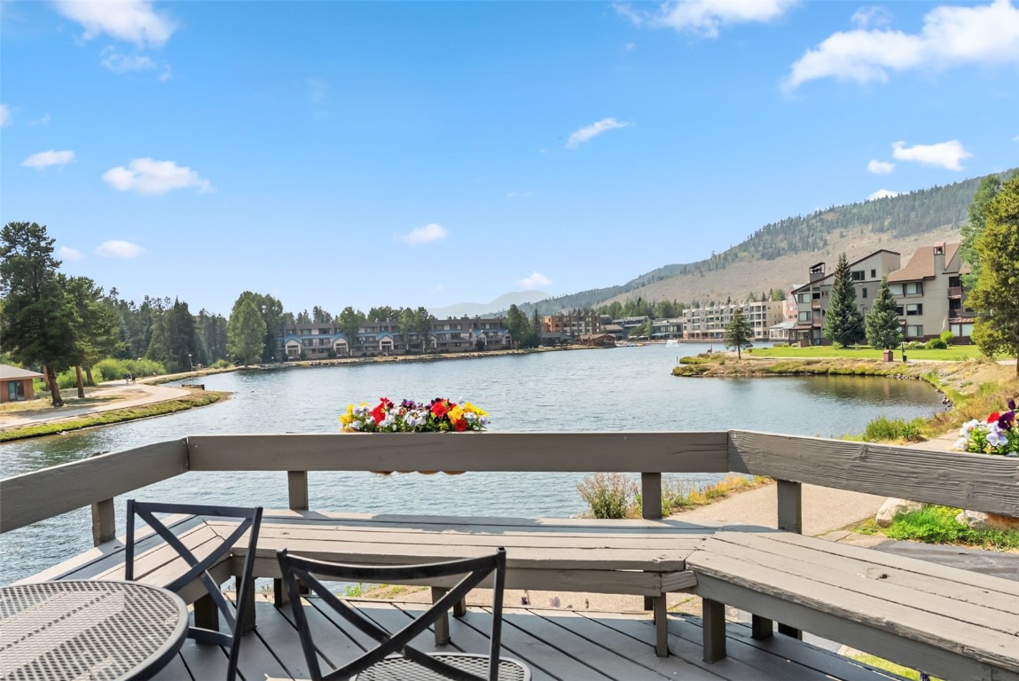 22300 Highway 6, Unit 1745 Keystone, CO 80435 - Photo 2 of 43 a view of swimming pool with outdoor seating and lake view