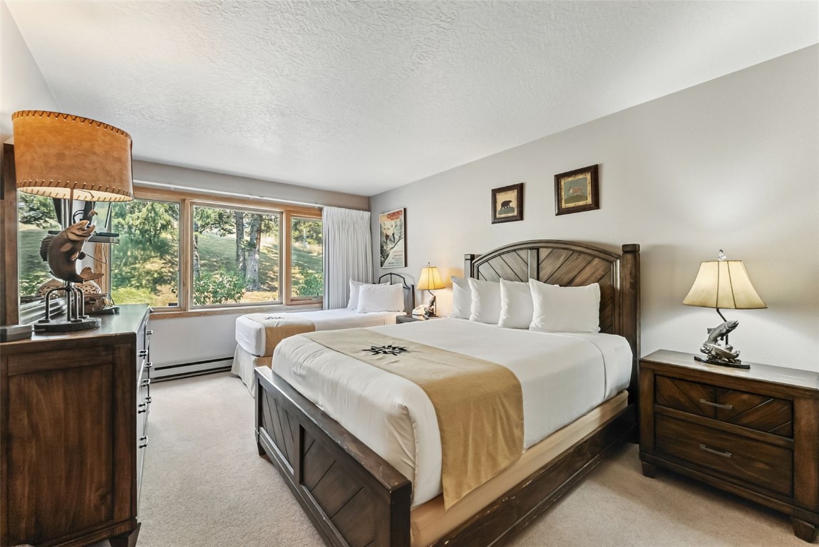 22300 Highway 6, Unit 1745 Keystone, CO 80435 - Photo 25 of 43 a bedroom with a bed and a window