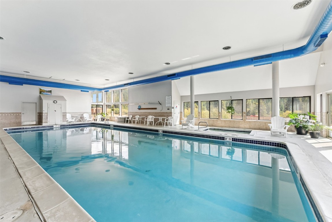 22300 Highway 6, Unit 1745 Keystone, CO 80435 - Photo 32 of 43 a view of a kitchen with kitchen island a large window a sink and counter space