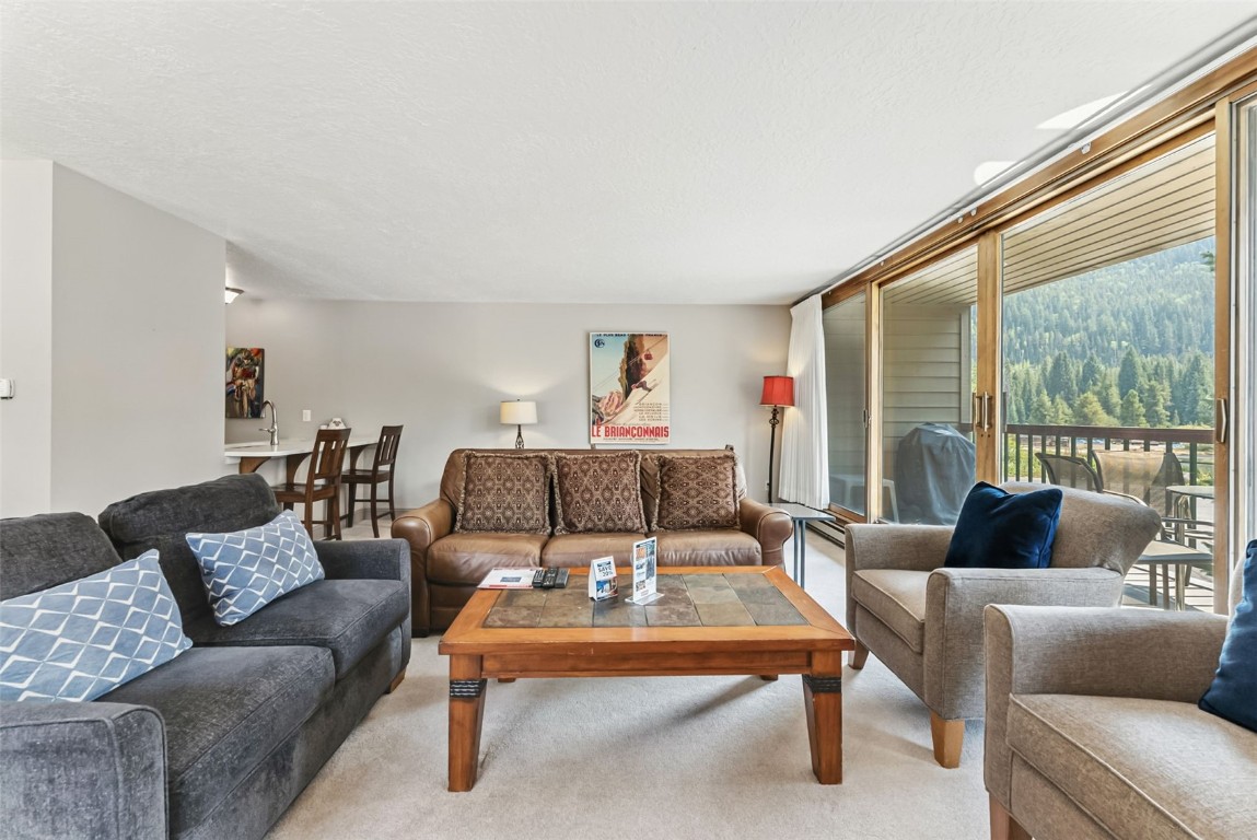 22300 Highway 6, Unit 1745 Keystone, CO 80435 - Photo 9 of 43 a living room with furniture and a large window