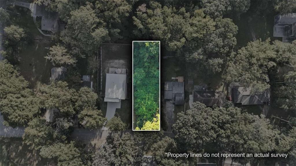 0 Pebble Drive Atlanta, GA 30344 - Photo 15 of 23 a green field with trees in the background