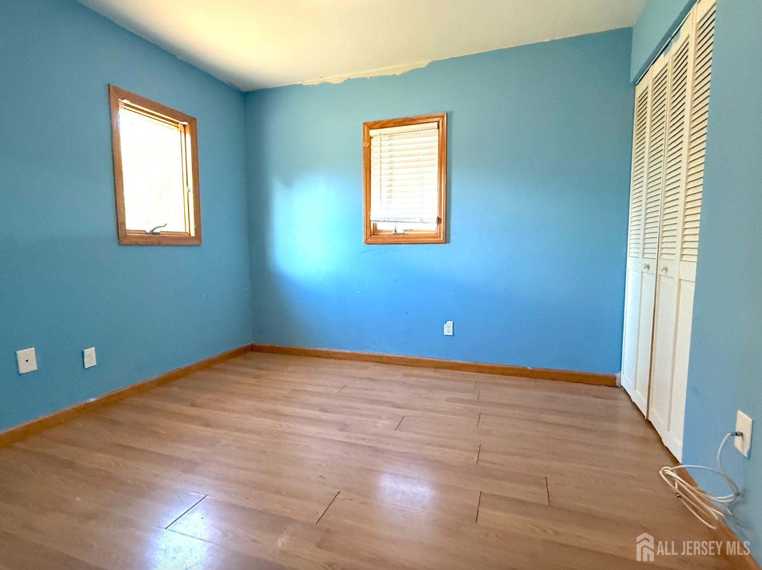 4 Forrestal Road Kendall Park, NJ 08824 - Photo 19 of 22 a view of a bedroom with a window and a ceiling fan