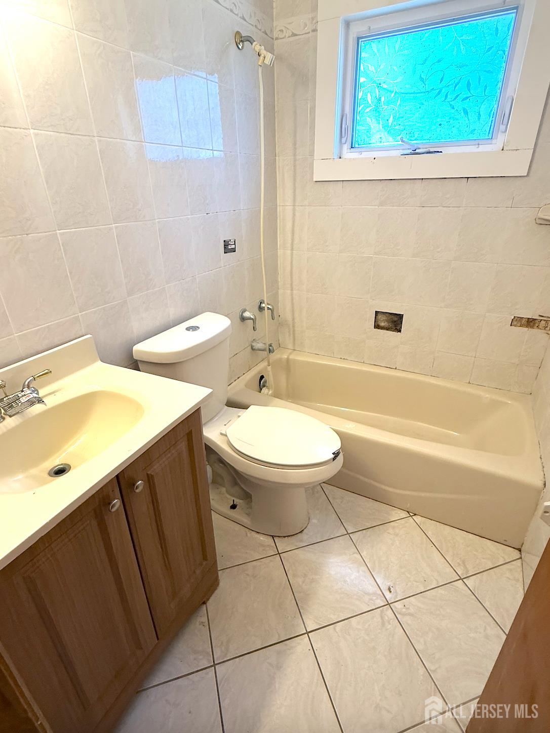 4 Forrestal Road Kendall Park, NJ 08824 - Photo 22 of 22 a bathroom with a sink a toilet and bathtub