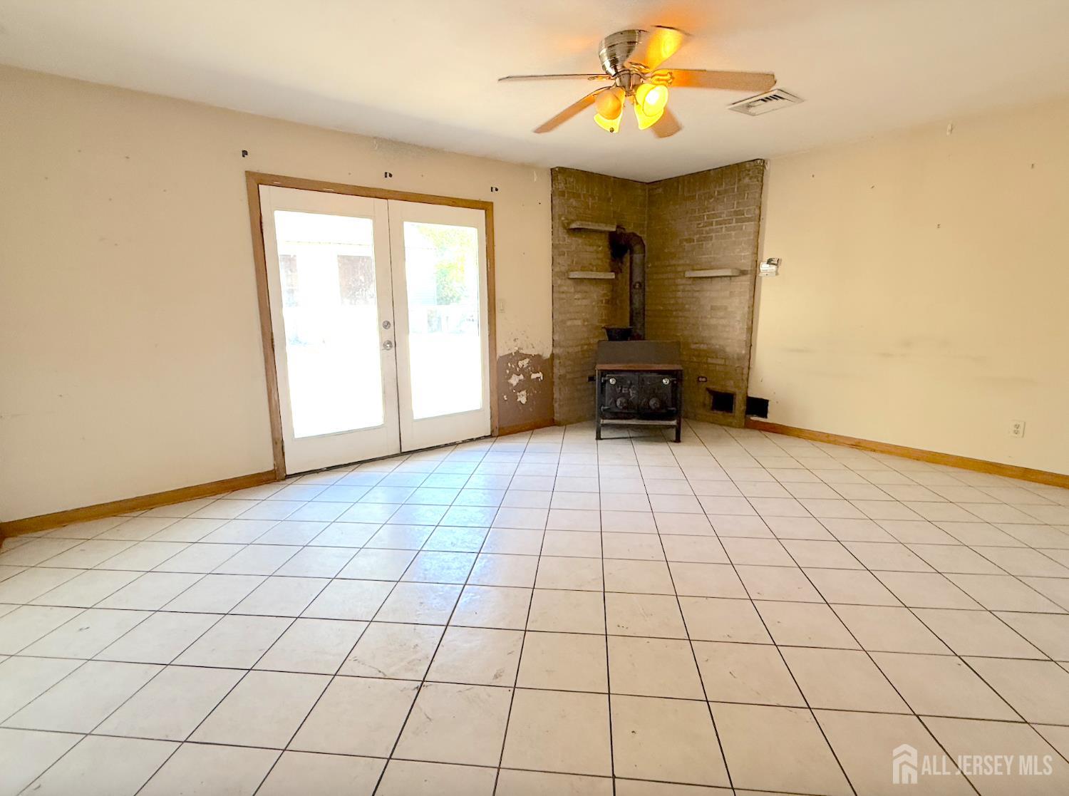 4 Forrestal Road Kendall Park, NJ 08824 - Photo 10 of 22 a view of an empty room and chandelier fan