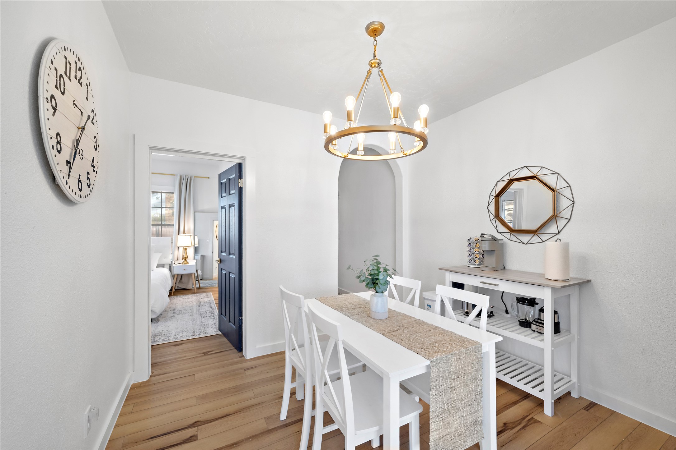 3901 Dallas Street, Unit B Houston, TX 77023 - Photo 10 of 32 a view of a dining room with furniture a chandelier and wooden floor