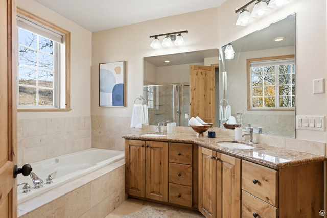 3026 Lower Saddleback Road Park City, UT 84098 - Photo 34 of 71 Bathroom featuring double vanity, healthy amount of natural light, a shower stall, and a garden tub