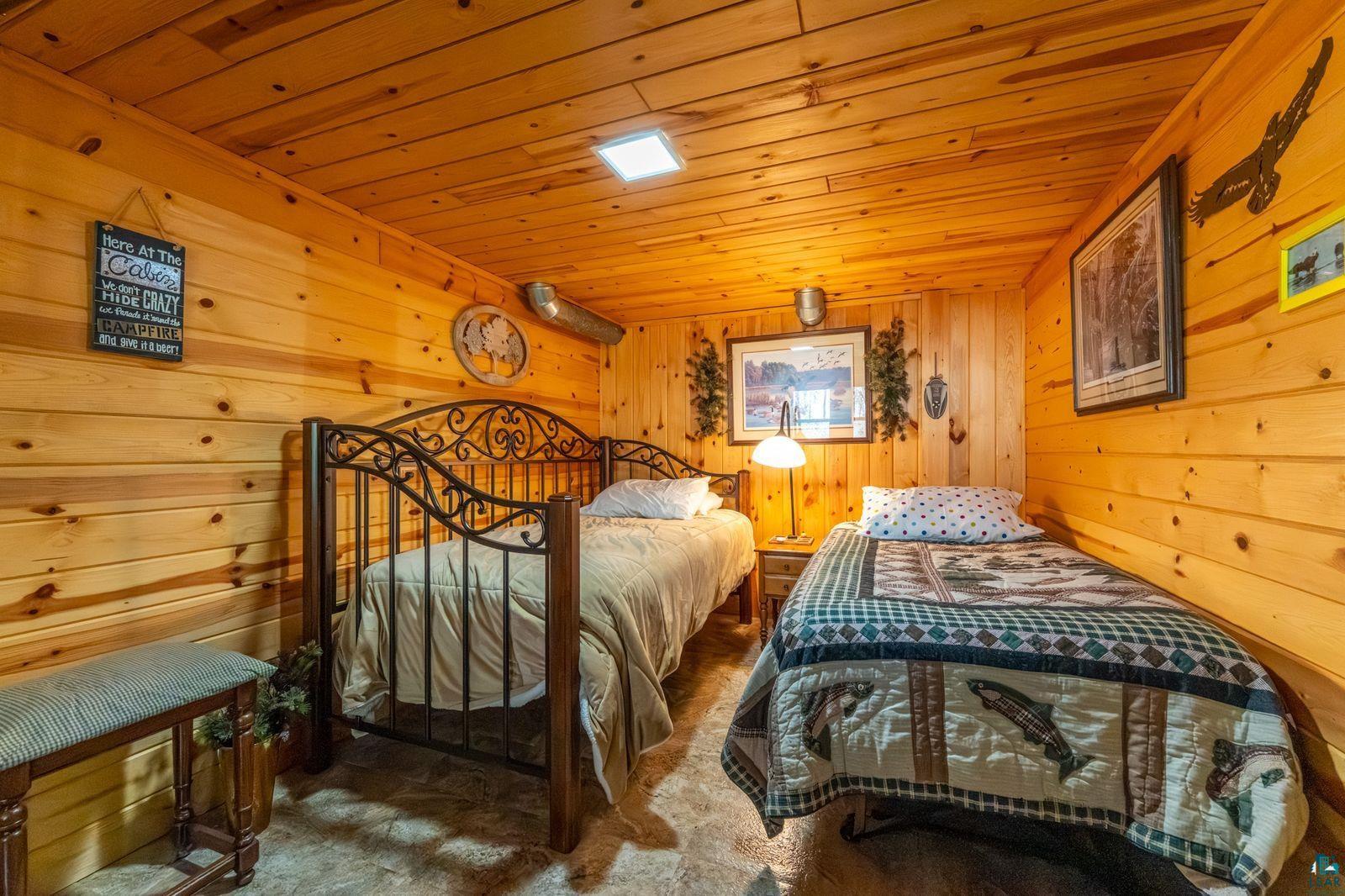 4452 Moccasin Point Road Tower, MN 55790 - Photo 25 of 44 Interior room featuring wood-paneled walls and ceiling, recessed ceiling lighting, and hard surface flooring