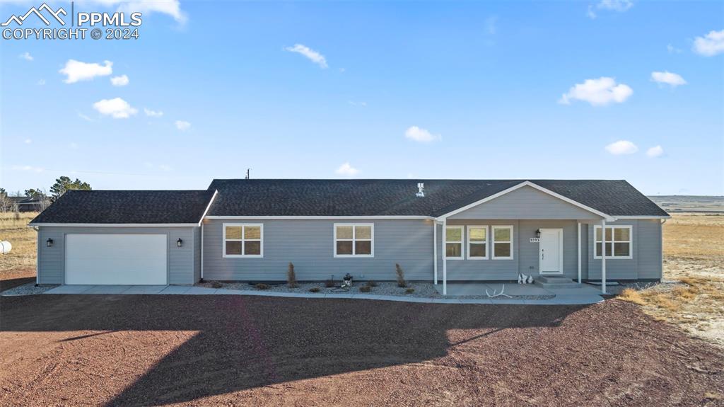 a front view of a house with yard