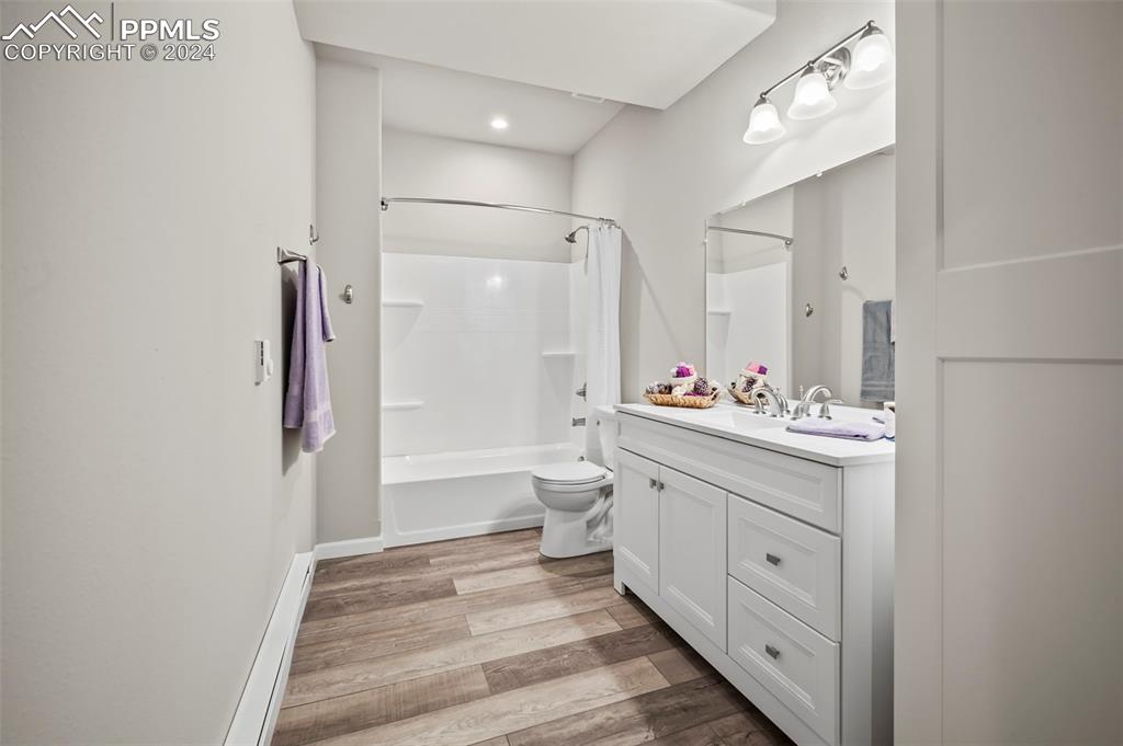 9393 North Log Road Calhan, CO 80808 - Photo 36 of 49 a bathroom with a double vanity sink mirror double and shower