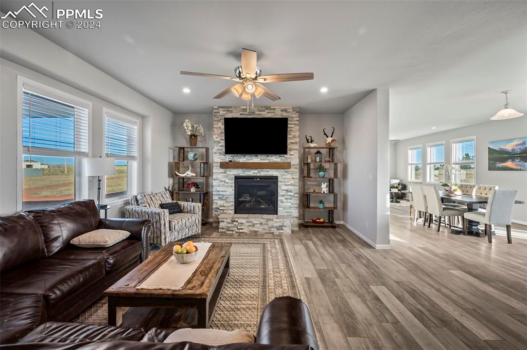 9393 North Log Road Calhan, CO 80808 - Photo 8 of 49 a living room with furniture fireplace and a flat screen tv