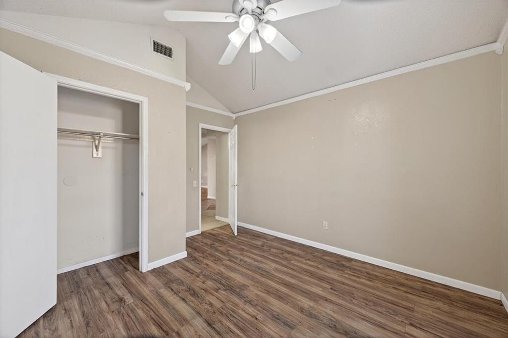 920 Danforth Place Arlington, TX 76017 - Photo 14 of 28 wooden floor in an empty room with a chandelier fan