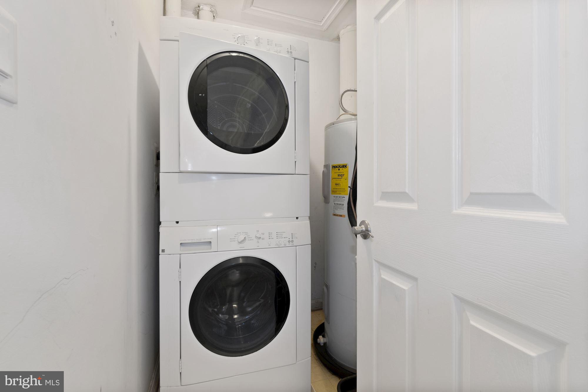 304 Ridgepoint Place, Unit 32 Gaithersburg, MD 20878 - Photo 26 of 28 a utility room with dryer and washer