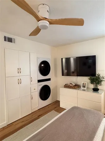 a bedroom with a bed and a night stand