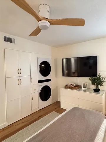 a bedroom with a bed and a night stand