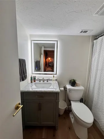 a bedroom with a bed and walk in closet