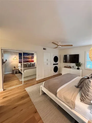 a kitchen with stainless steel appliances granite countertop a refrigerator stove top oven and sink