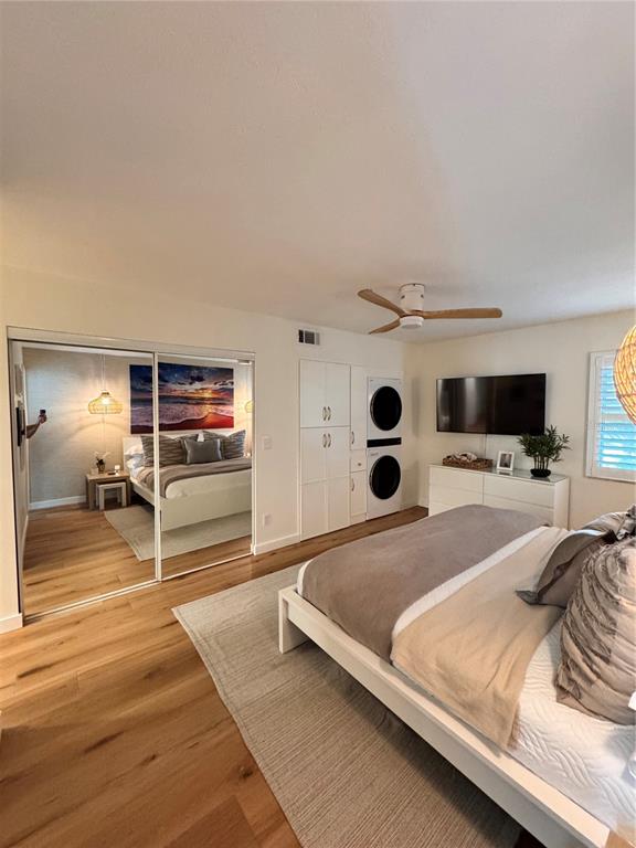5623 Midnight Pass Road, Unit 615 Siesta Key, FL 34242 - Photo 17 of 21 a bedroom with a bed and walk in closet