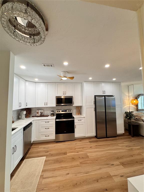 5623 Midnight Pass Road, Unit 615 Siesta Key, FL 34242 - Photo 18 of 21 a kitchen with stainless steel appliances granite countertop a refrigerator stove top oven and sink