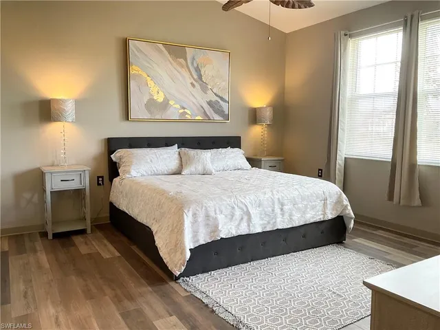 a bedroom with a large bed and a window