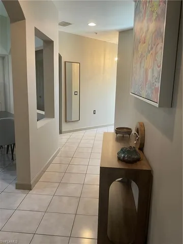 a room with a couch and a stove top oven