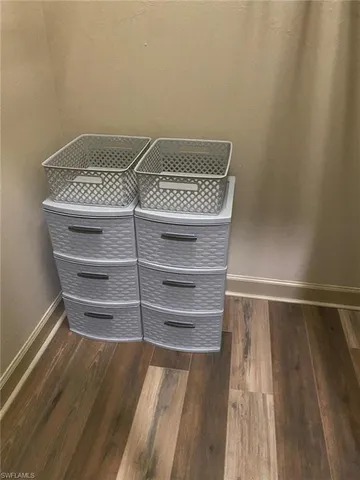 a view of walk in closet with empty racks