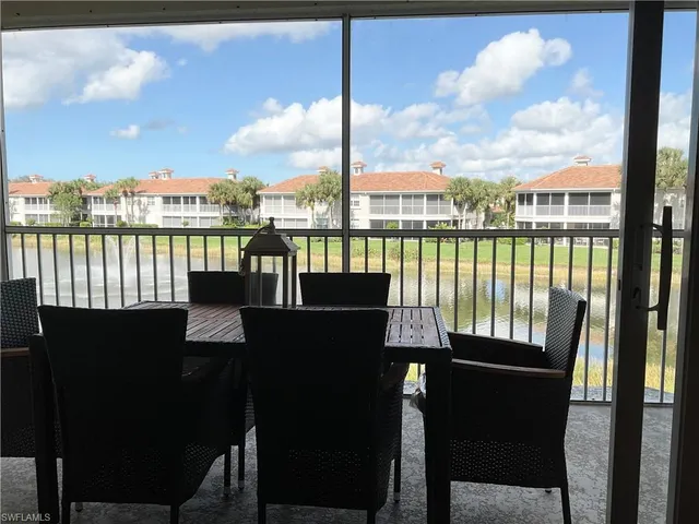 a view of a balcony with two chairs