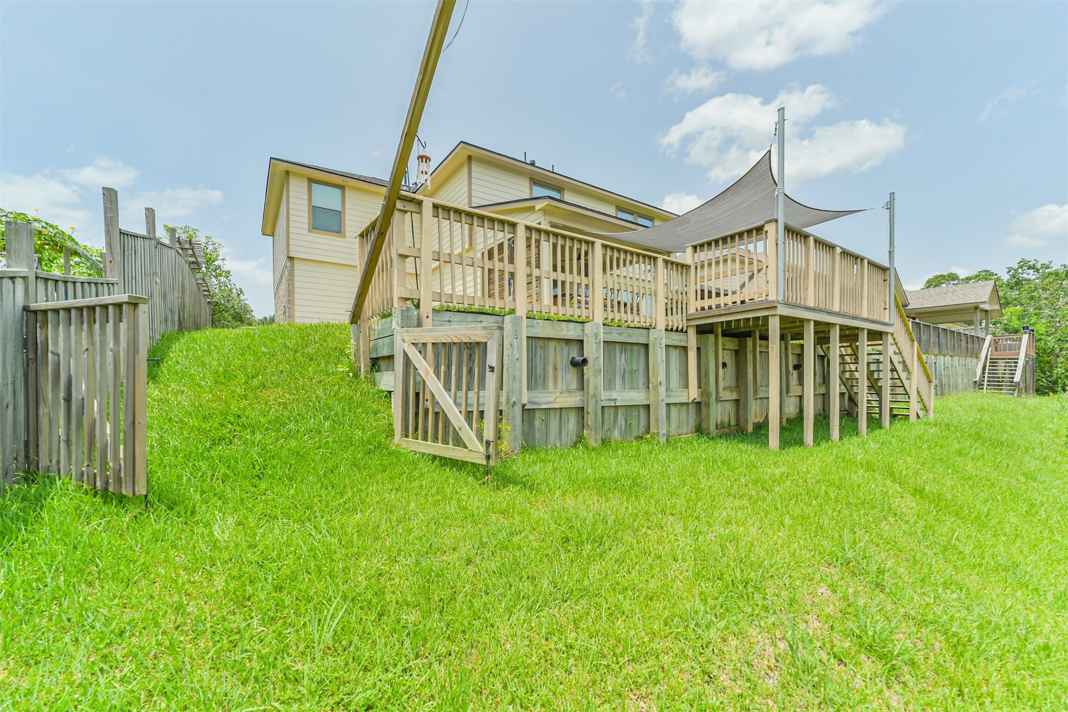 12009 La Salle River Road Conroe, TX 77304 - Photo 45 of 50 a view of an house with backyard and porch