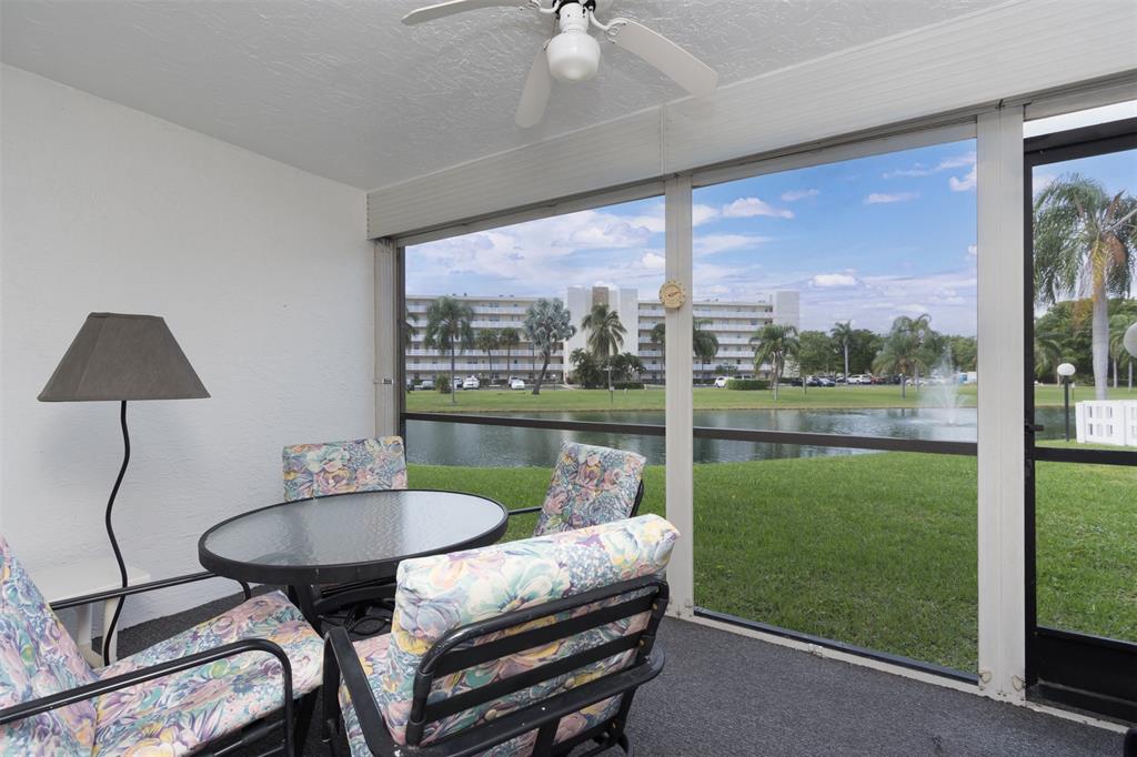 190 Southeast 5th Avenue, Unit 108 Dania Beach, FL 33004 - Photo 1 of 40 a balcony with table and chairs