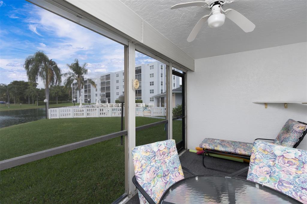 190 Southeast 5th Avenue, Unit 108 Dania Beach, FL 33004 - Photo 15 of 40 a living room with furniture and a garden