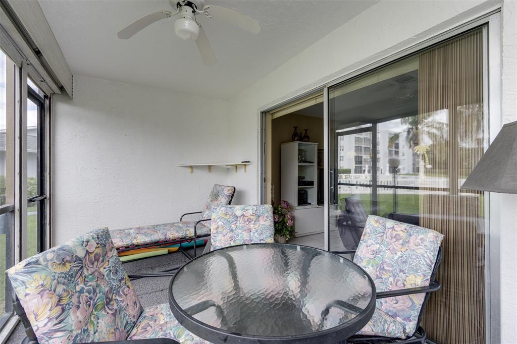 190 Southeast 5th Avenue, Unit 108 Dania Beach, FL 33004 - Photo 16 of 40 a living room with furniture and a table