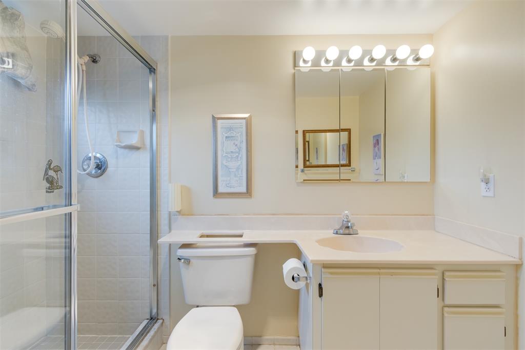 190 Southeast 5th Avenue, Unit 108 Dania Beach, FL 33004 - Photo 25 of 40 a bathroom with a sink a toilet and shower