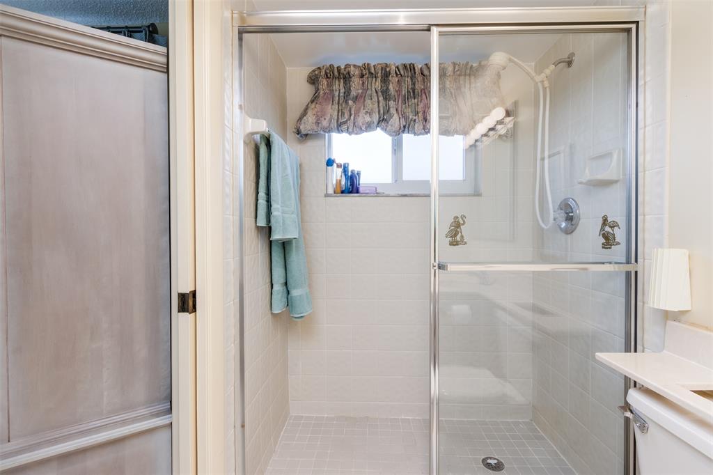190 Southeast 5th Avenue, Unit 108 Dania Beach, FL 33004 - Photo 26 of 40 a bathroom with a shower and a sink