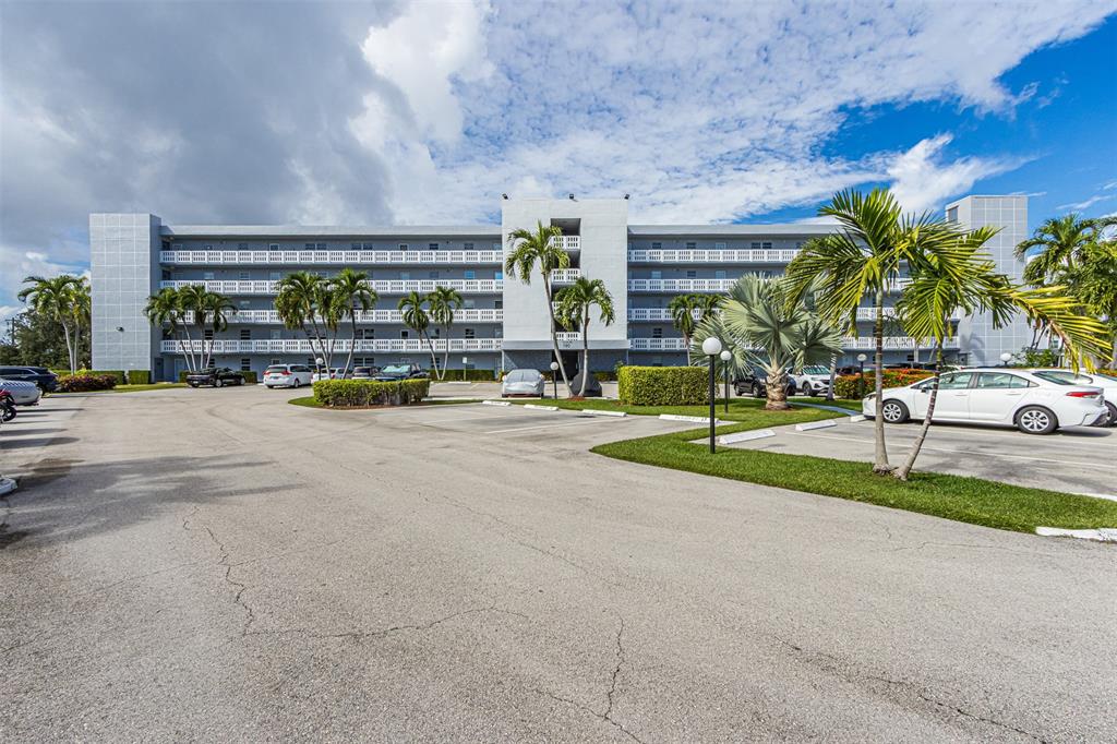 190 Southeast 5th Avenue, Unit 108 Dania Beach, FL 33004 - Photo 37 of 40 a view of swimming pool with outdoor seating and yard