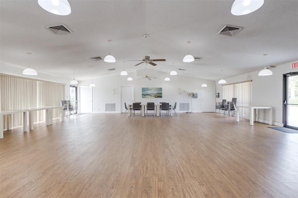 190 Southeast 5th Avenue, Unit 108 Dania Beach, FL 33004 - Photo 40 of 40 a view of a big room with wooden floor and windows