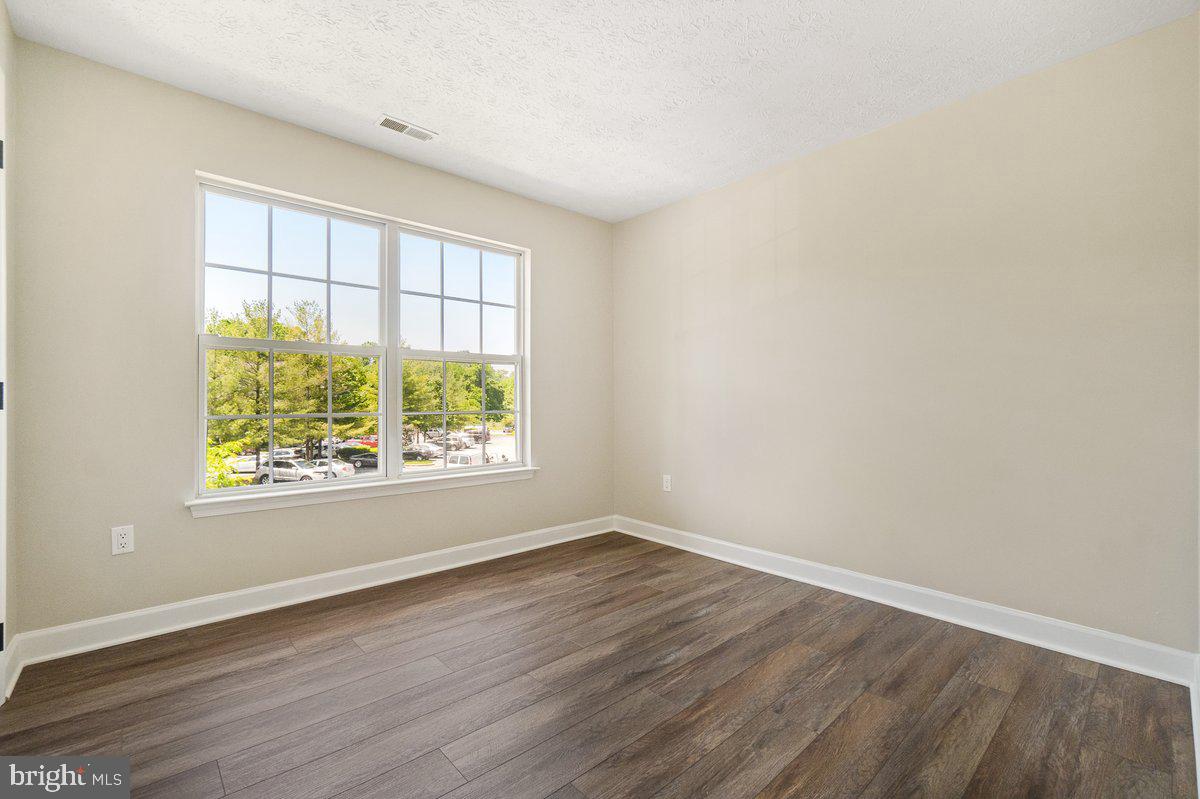 6101 Springwater Place, Unit 1203 Frederick, MD 21701 - Photo 14 of 36 Spare Bedroom