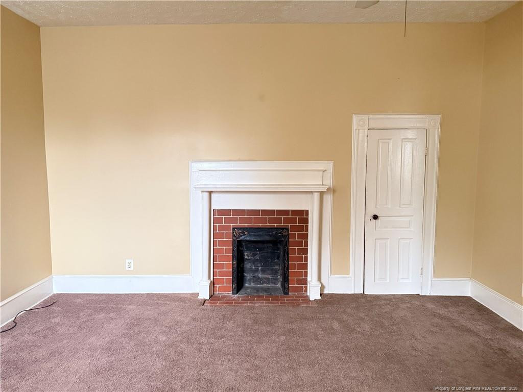 1201 Clark Street Fayetteville, NC 28305 - Photo 2 of 9 a view of empty room with a fireplace