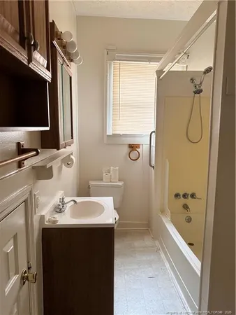 a bathroom with a sink a mirror and a bathtub