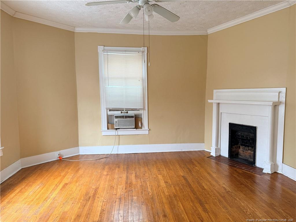 1201 Clark Street Fayetteville, NC 28305 - Photo 9 of 9 a view of an empty room with a window and a fireplace