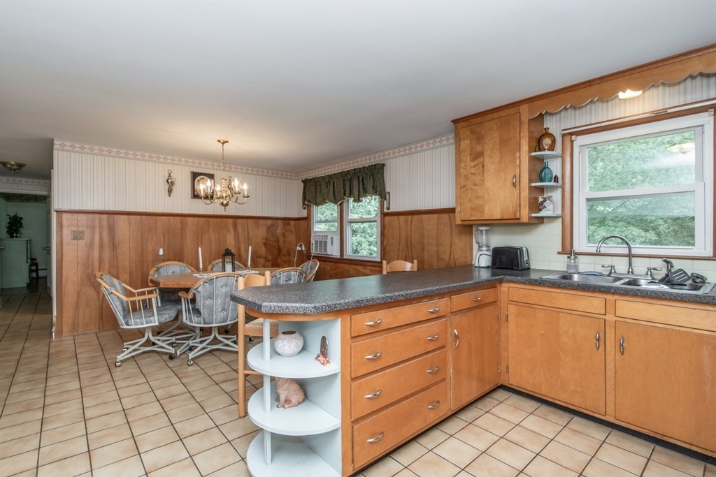 114 Arnold Road Sturbridge, MA 01518 - Photo 11 of 31 a kitchen with a sink and cabinets