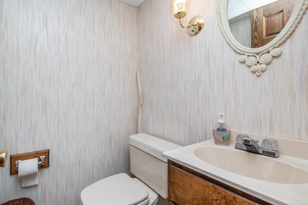 114 Arnold Road Sturbridge, MA 01518 - Photo 20 of 31 a bathroom with a sink a toilet and a mirror