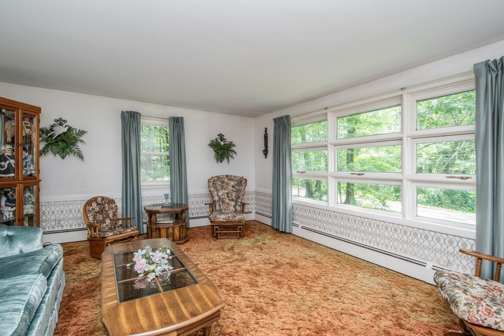 114 Arnold Road Sturbridge, MA 01518 - Photo 6 of 31 a living room with furniture and a large window