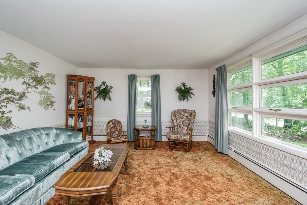 114 Arnold Road Sturbridge, MA 01518 - Photo 7 of 31 a living room with furniture and a large window