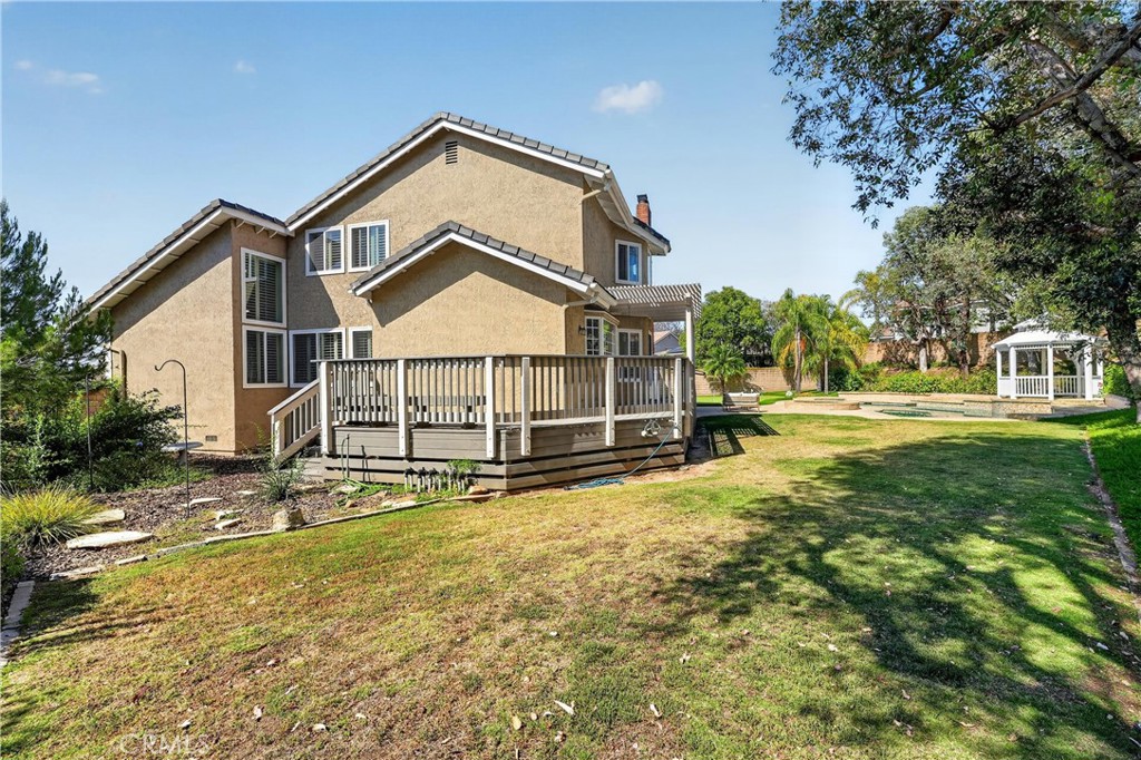 2935 Bluebell Avenue Brea, CA 92821 - Photo 34 of 38 Generous side yard with deck and grass area, ideal for play and outdoor enjoyment