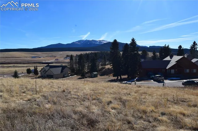 a view of a car park in front of the house