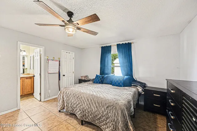 a bedroom with a bed and cabinets