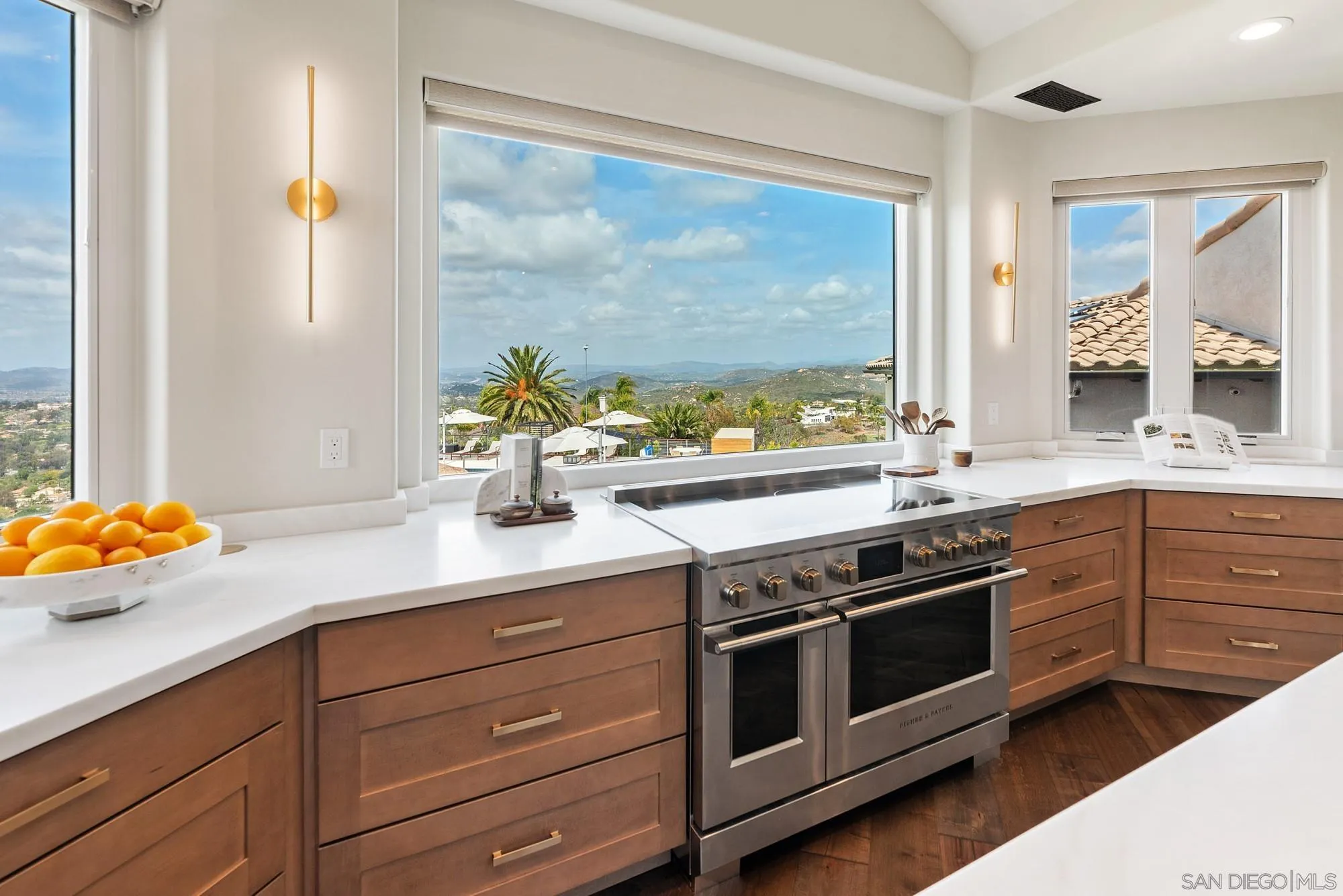 15484 Markar Road Poway, CA 92064 - Photo 13 of 75 a kitchen with stainless steel appliances a stove and a window