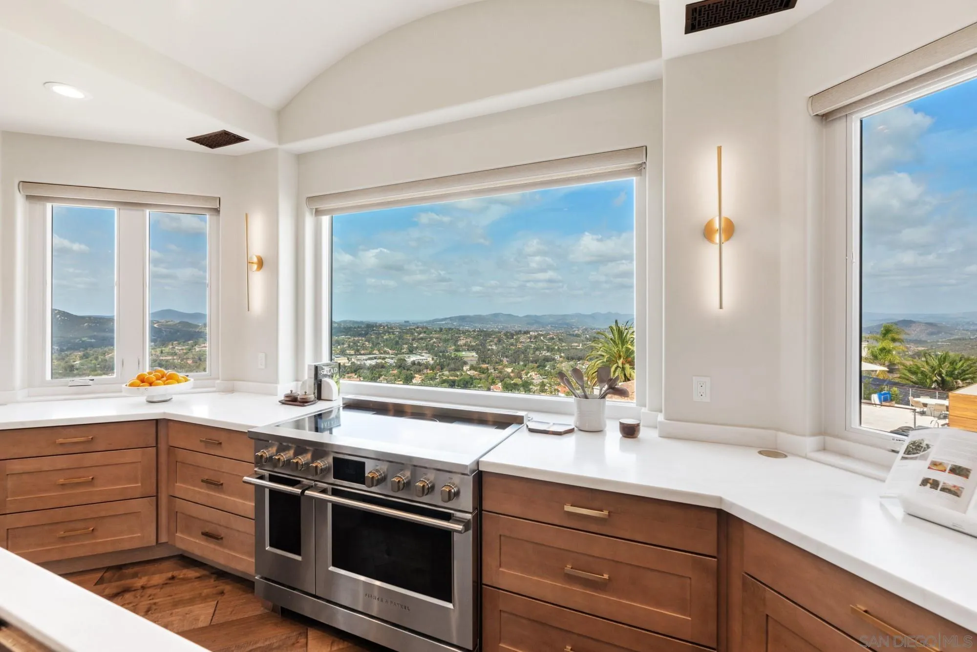 15484 Markar Road Poway, CA 92064 - Photo 16 of 75 a view of a sink and dishwasher with wooden floor