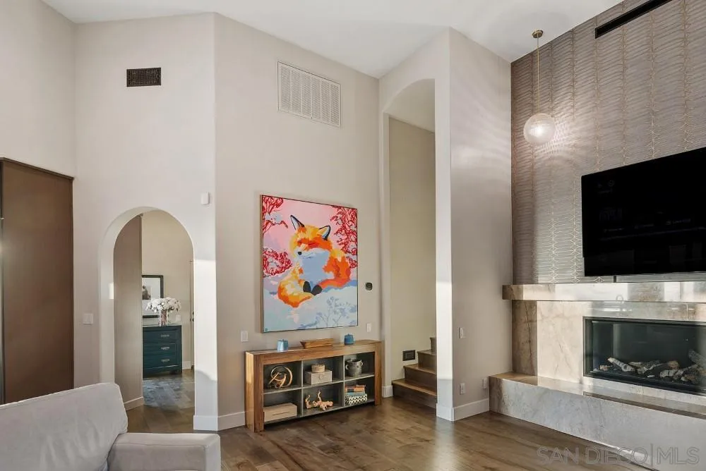 15484 Markar Road Poway, CA 92064 - Photo 20 of 75 a living room with fireplace furniture and flat screen tv