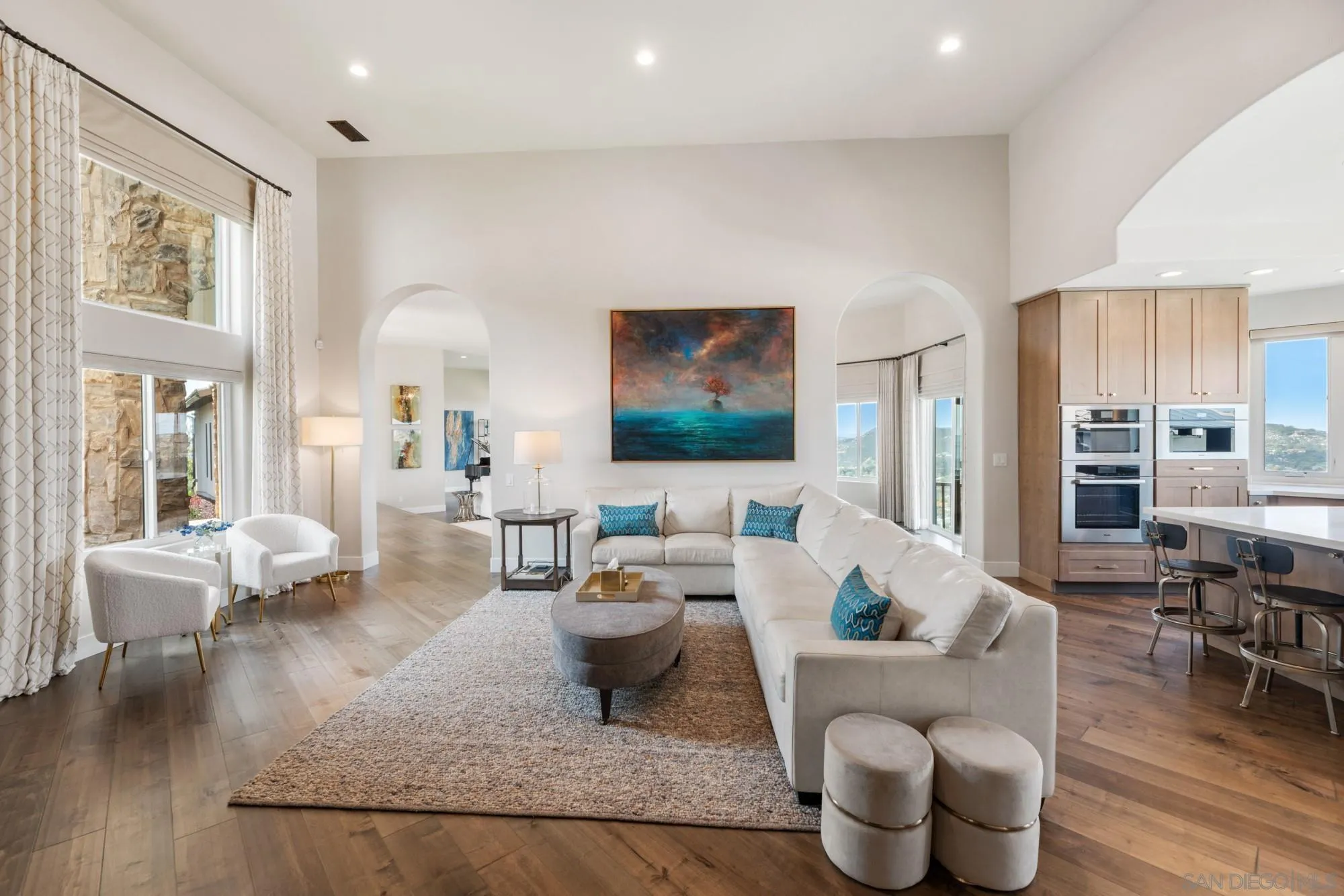 15484 Markar Road Poway, CA 92064 - Photo 21 of 75 a living room with furniture large window and wooden floor
