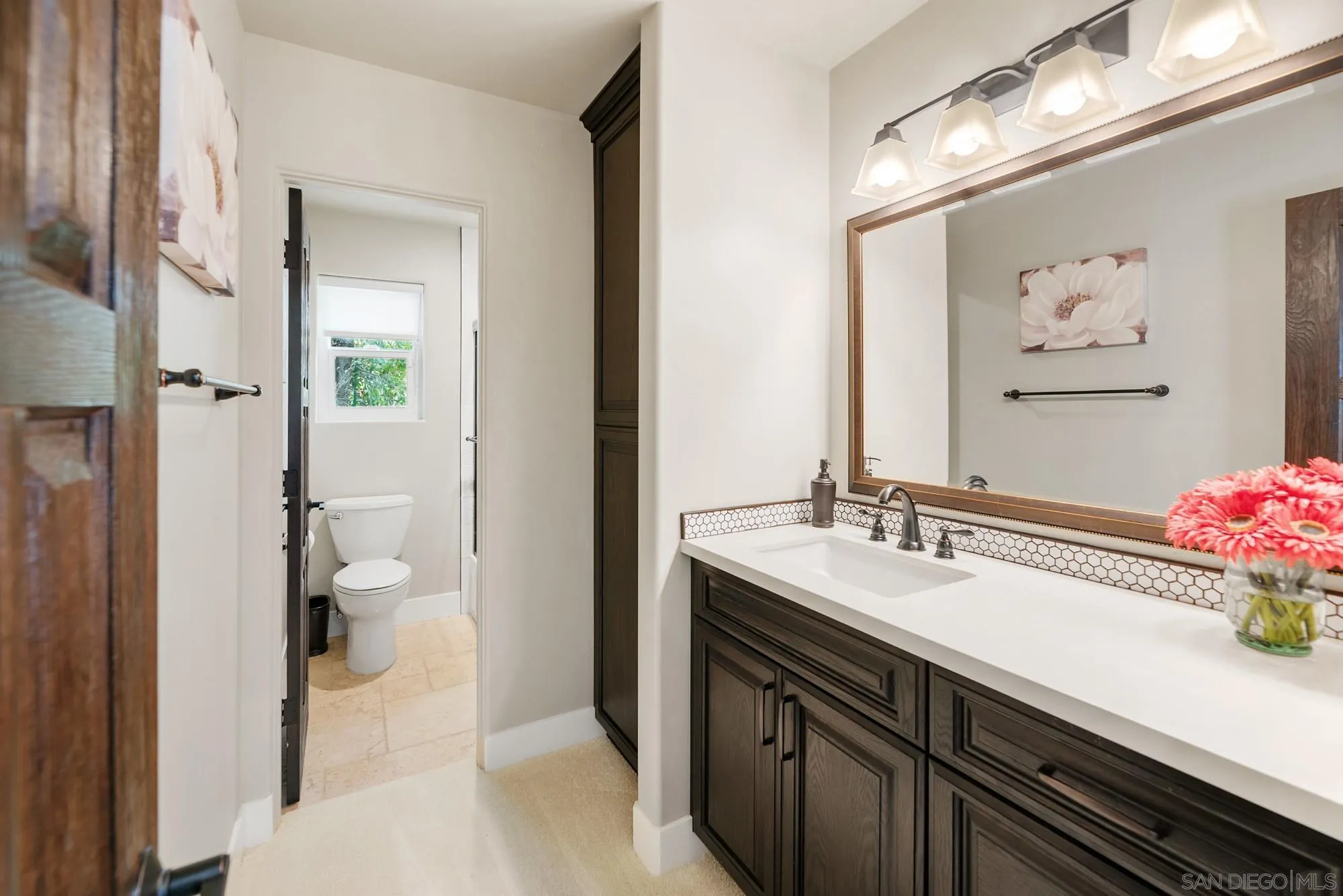 15484 Markar Road Poway, CA 92064 - Photo 42 of 75 a bathroom with a sink and a mirror